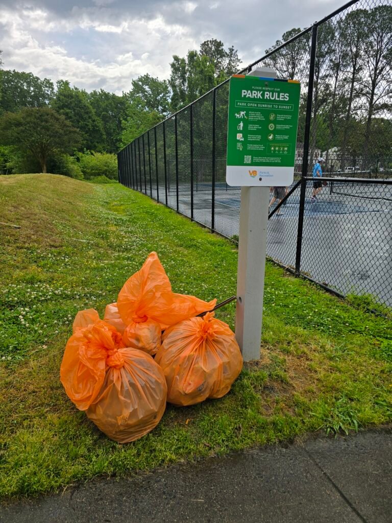 A pile of trash bags, that were filled during a park clean-up event.